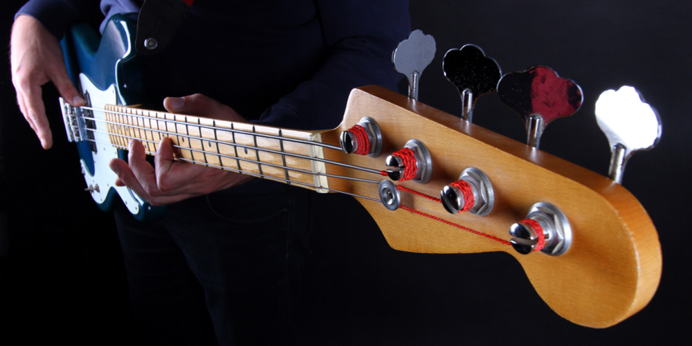 Featured image for home page of Knoxville Bass Lessons dotcom depicting male playing a classic electric bass guitar.